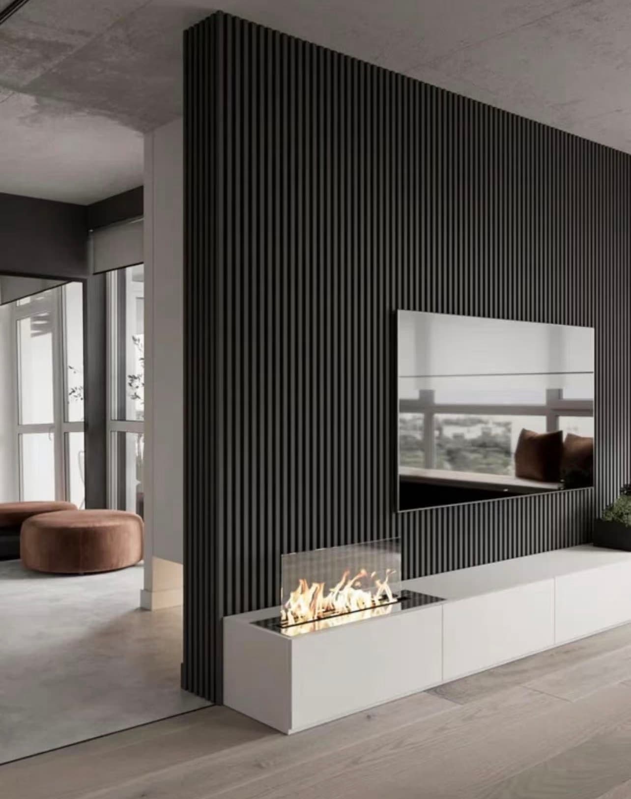 Dark slat feature wall with an integrated fireplace in a lounge